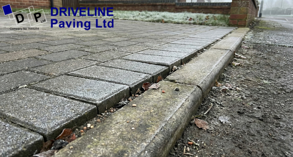 Weak or shifting edge restraints allow frost-driven movement to spread across block paving surfaces.