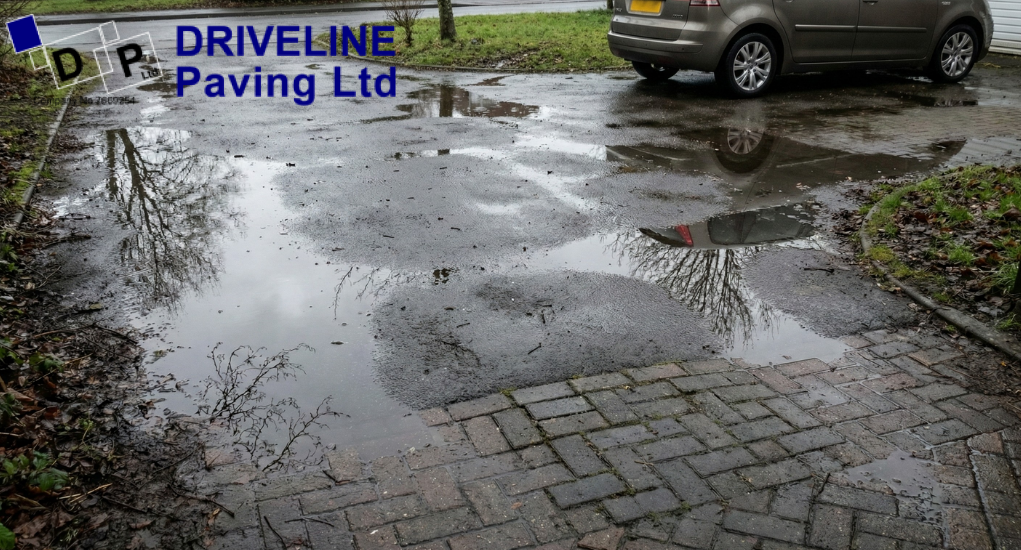 Standing water after rain is often the first sign that driveway drainage needs attention before winter freezing begins.