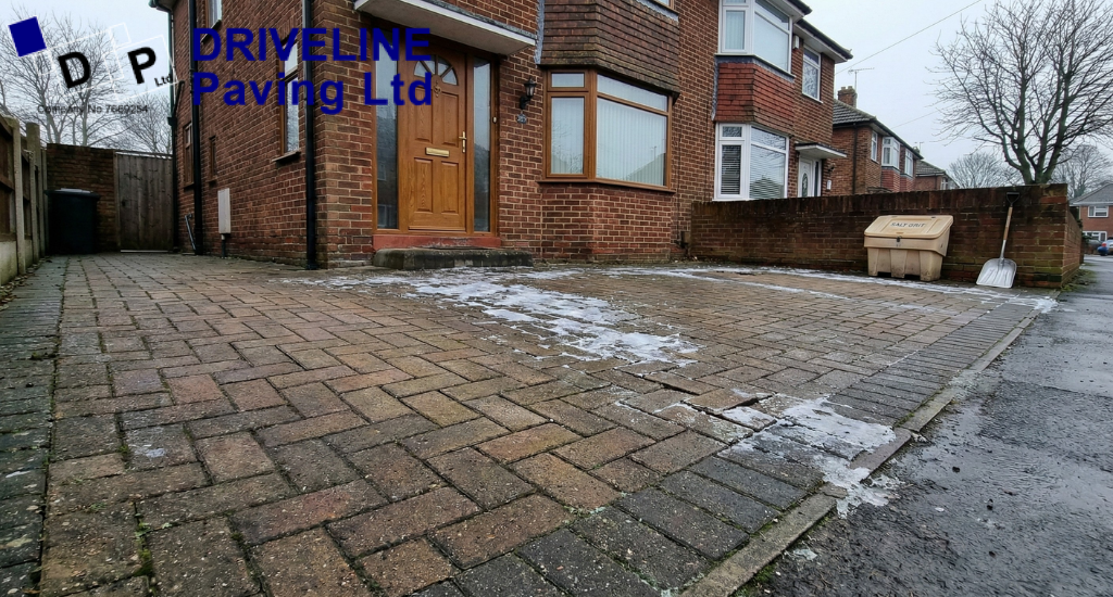 Uneven driveway sections close to the house become more hazardous in January as frost highlights changes in surface level.