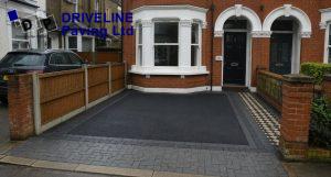 tarmac driveway with block paving border outside an enfield home