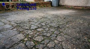 Interconnected fatigue cracking across a tarmac driveway surface indicating that the sub-base has failed